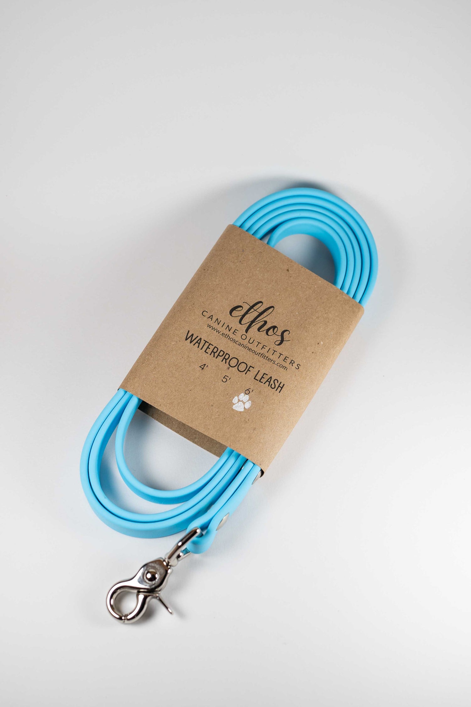 6' light blue dog leash in a leash wrap against a white background